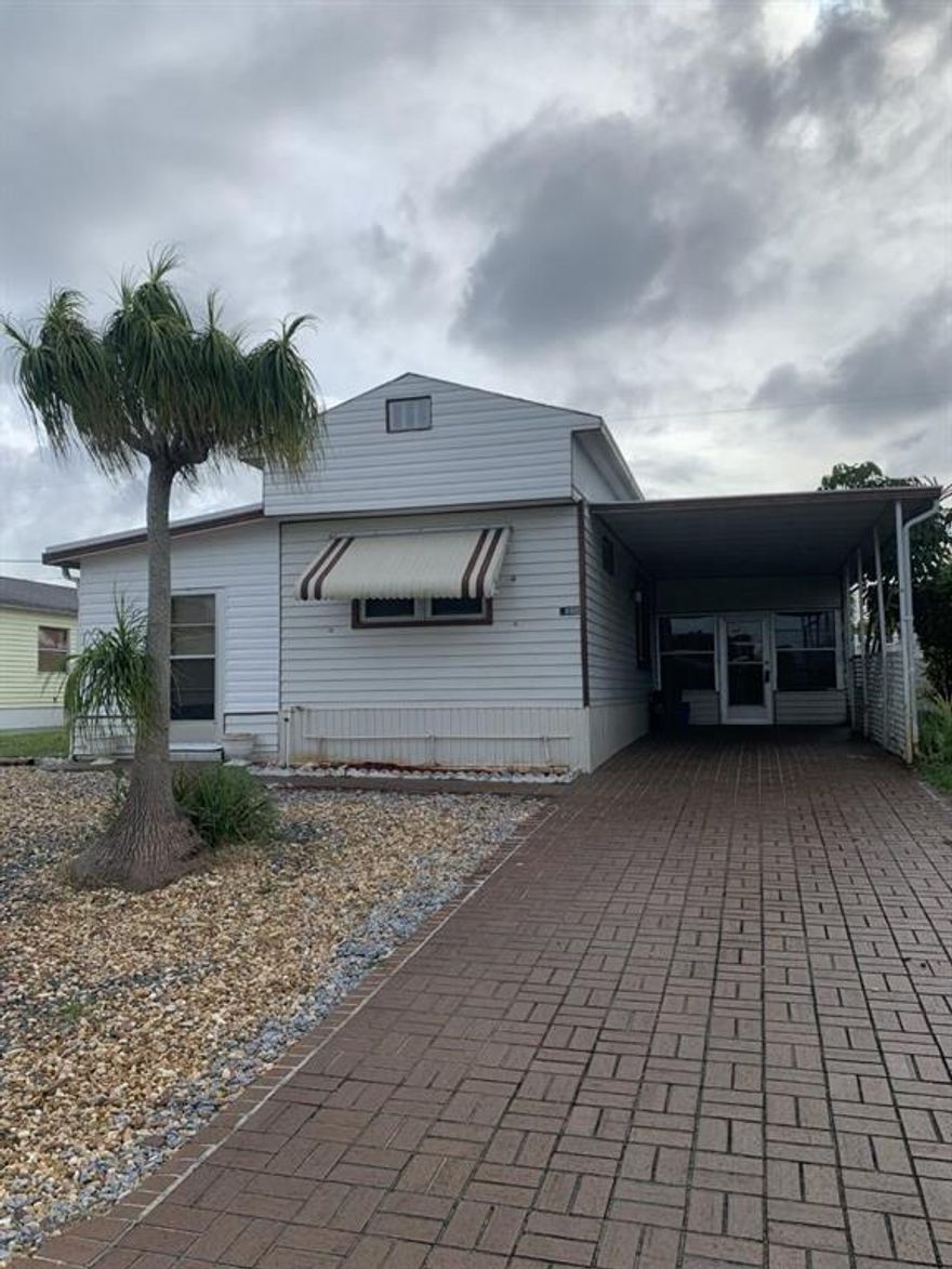 Spacious home, split plan with a bedroom and bathroom on each end.  Large open kitchen/living area. Property is a little tired will need a little TLC.   Minutes away from the Hobe Sound beach also Jimmy Graham Park with public boat ramp, right around the corner.  No HOA, bring the boat and truck and pets.  Great Martin County Schools.