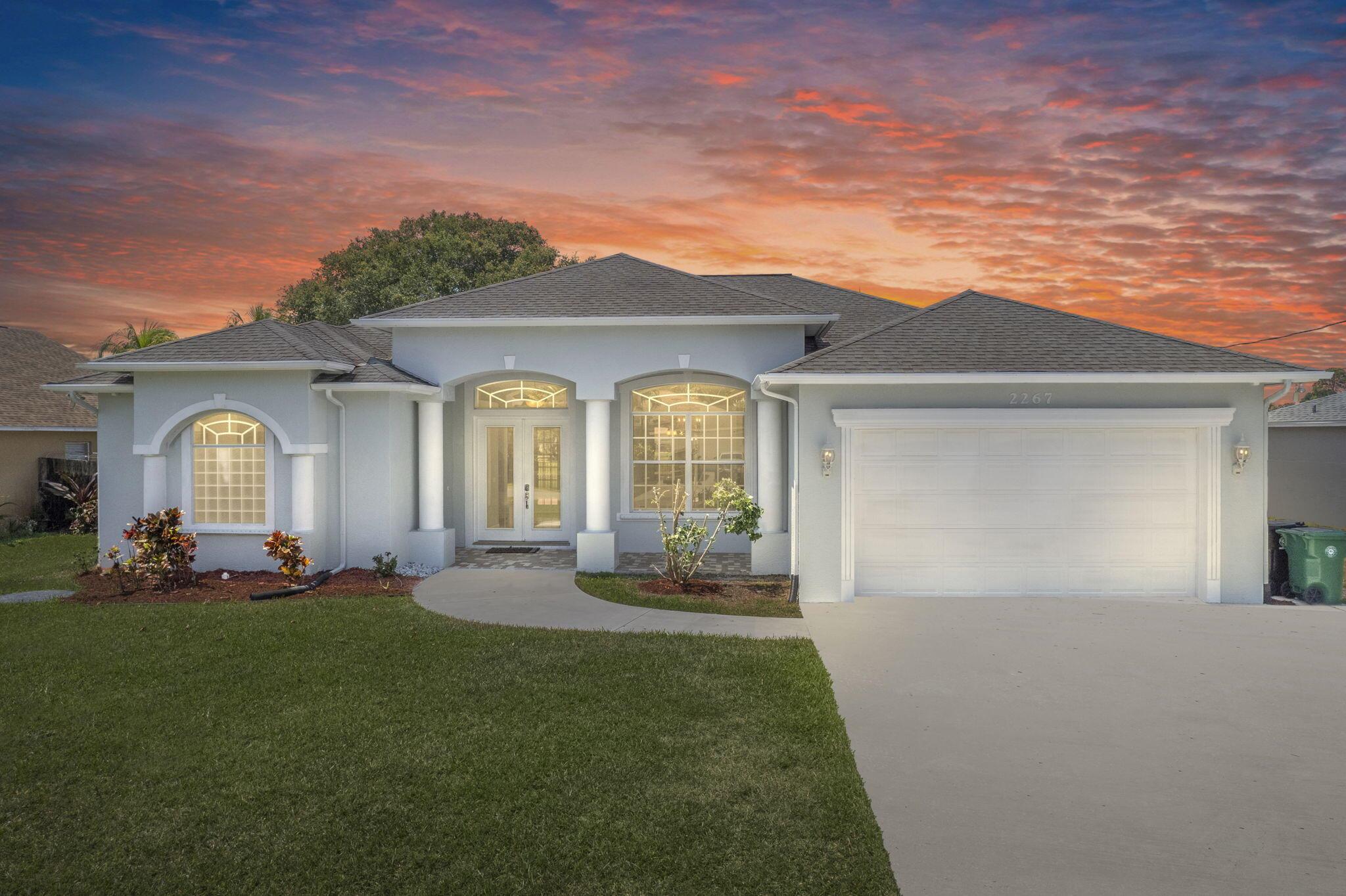 Canal-front comfort meets coastal convenience! Tucked between beaches, boat ramps, and golf courses, this canal-front retreat places you near all the best surf & turf amenities--with no HOA restrictions to limit your lifestyle. Bring the boat, skip the fuss, and settle into a serene setting that balances beauty and practicality. Inside, soaring volume ceilings and an abundance of natural light create a spacious, airy feel. The split floor plan offers both privacy and flow, anchored by a cozy fireplace perfect for Florida's rare chilly nights. The kitchen features all-new stainless steel appliances, granite countertops, and ample bar seating that opens seamlessly to the living area--perfect for entertaining or everyday ease.
