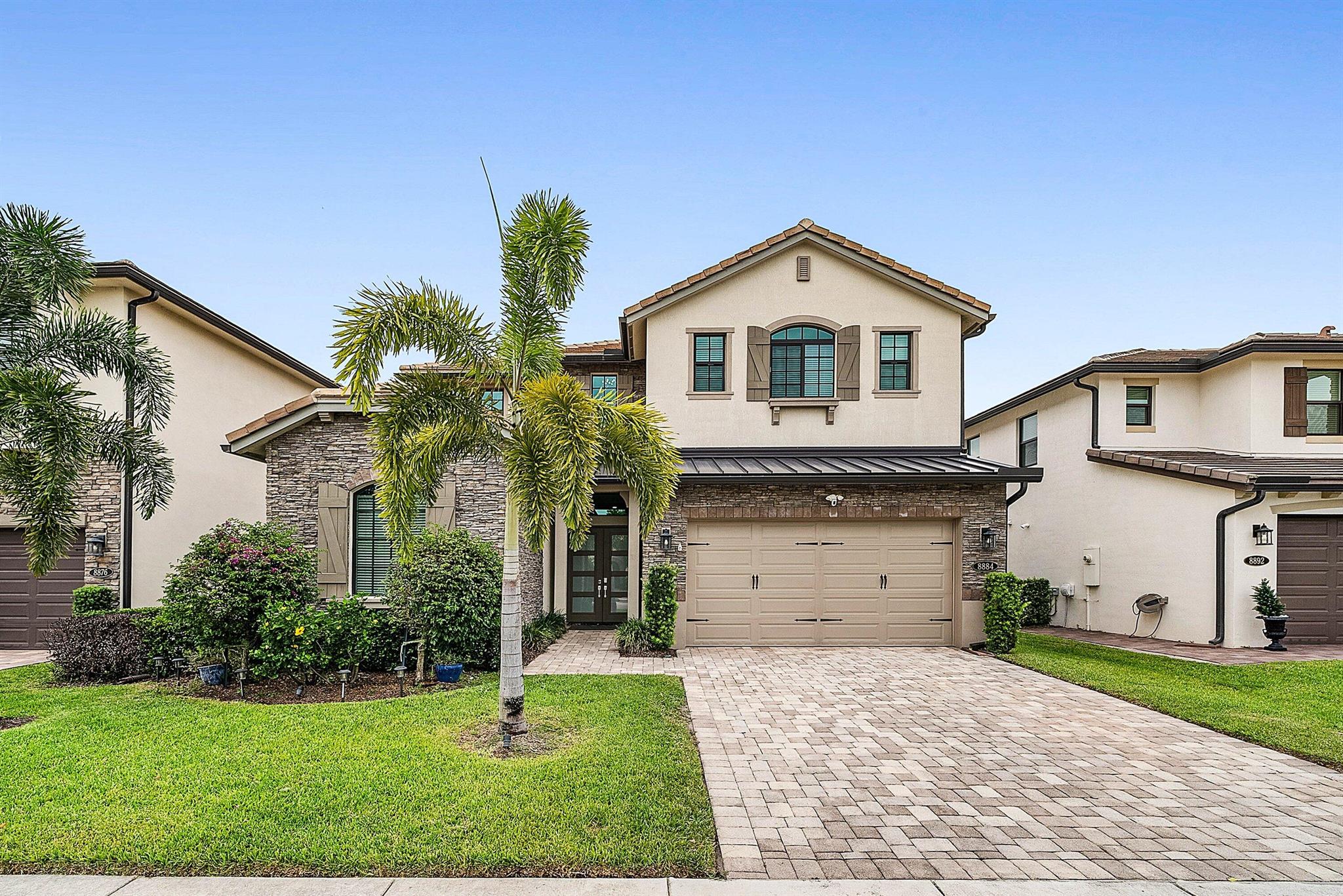 Elegantly upgraded stunning lakefront home impresses from the moment you step inside w/t soaring 20ft foyer & elevated ceilings. Gourmet chef's kitchen boasts a gas cooktop, wall oven, walk-in pantry & designer lighting. The expanded ground-floor master suite features serene lake views, custom walk-in closets and & luxurious spa-inspired bath. Upstairs offers a spacious loft & 2 bedrooms/2 baths. Additional highlights include full house generator, impact windows, retractable screen, custom closets, whole house water filtration, overhead garage storage & more. Palm Meadows is a guard-gated community offering resort-style amenities: clubhouse, fitness center, aerobic room, pool/hot tub, kiddie pool, splash zone, playroom, tennis, pickleball, indoor basketball, playground & covered BBQ area.