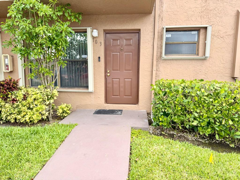 Photo of 10059 Winding Lake Road #103, Sunrise, FL 33351 (MLS # B26017328)