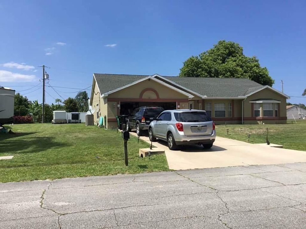 Photo of 592 SW Lovell Ter, Port St Lucie, FL 34953 (MLS # R10899562)