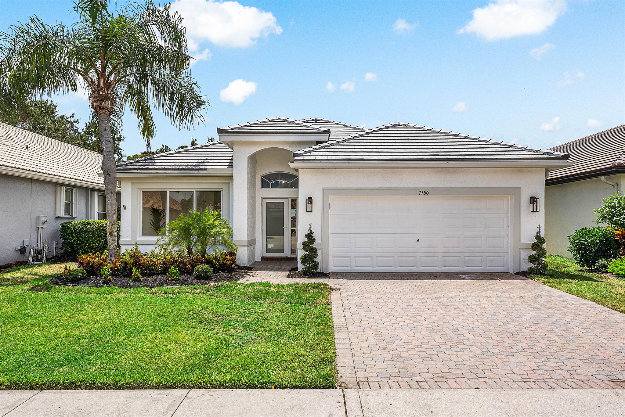 A not-to-be-missed opportunity to own a like-new, completely upgraded 4 bedroom home with over 2,300 square feet of refined living space. From the moment you arrive, you'll notice that no detail has been overlooked! This home exudes quality, elegance, & thoughtful design.Enjoy complete storm protection w/ FULL IMPACT WINDOWS & DOORS and a BRAND NEW ROOF, offering both peace of mind & elevated curb appeal. The chef's kitchen is a true showpiece, featuring a suite of top-tier stainless steel appliances, including wine fridge, dramatic designer hood, all perfectly complemented by custom cabinetry & premium finishes.The interior is a study in sophistication, with designer-curated bathrooms w/ freestanding tub, frameless walk-in shower, that evokes spa-like luxury.
