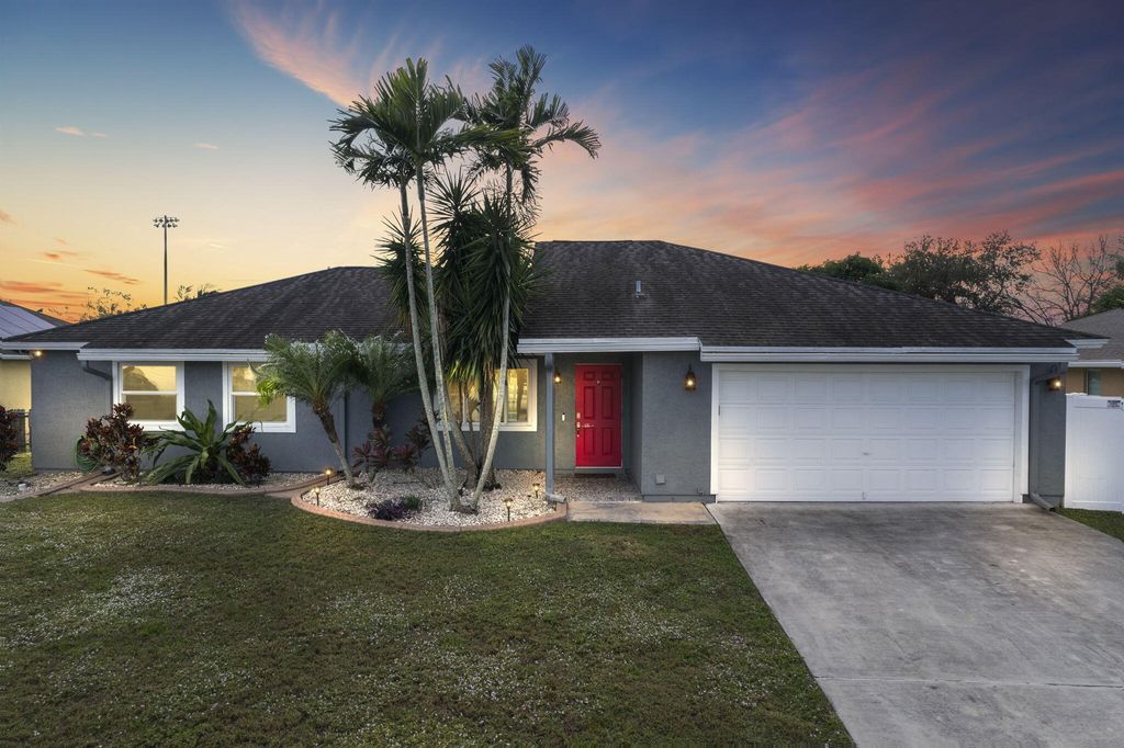 Photo of 762 SW Dolores Avenue, Port Saint Lucie, FL 34983 (MLS # R10958590)