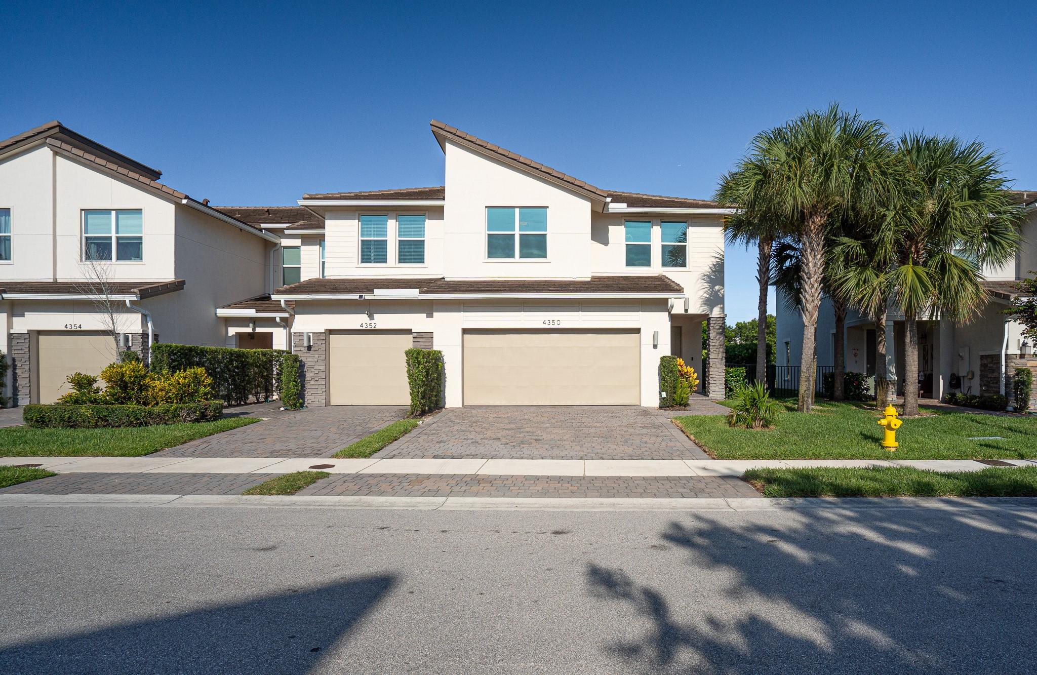 Take a look at this stunningly modern 3 bed/2.5 bath canal front townhouse (with 2 car garage) built in 2020 and located in the desirable gated community of Veileros at Crystal Lake. You enter through a covered entry into a gracious foyer that leads to a powder room and a two-car garage. From there, in the kitchen, you'll notice the island, pantry, and spacious living room with a fenced backyard and waterfront backdrop. As you head upstairs, you'll find a loft area, three bedrooms, 2 full bathrooms, and a laundry room. The HOA fee is low, covering lawn care and top-tier amenities: pool, fitness center, clubhouse, playground, and on-site management. Ideally located just minutes from I-95, 11 minutes to the beach, and close to Costco, Whole Foods, Boca town center, restaurants and shopping.