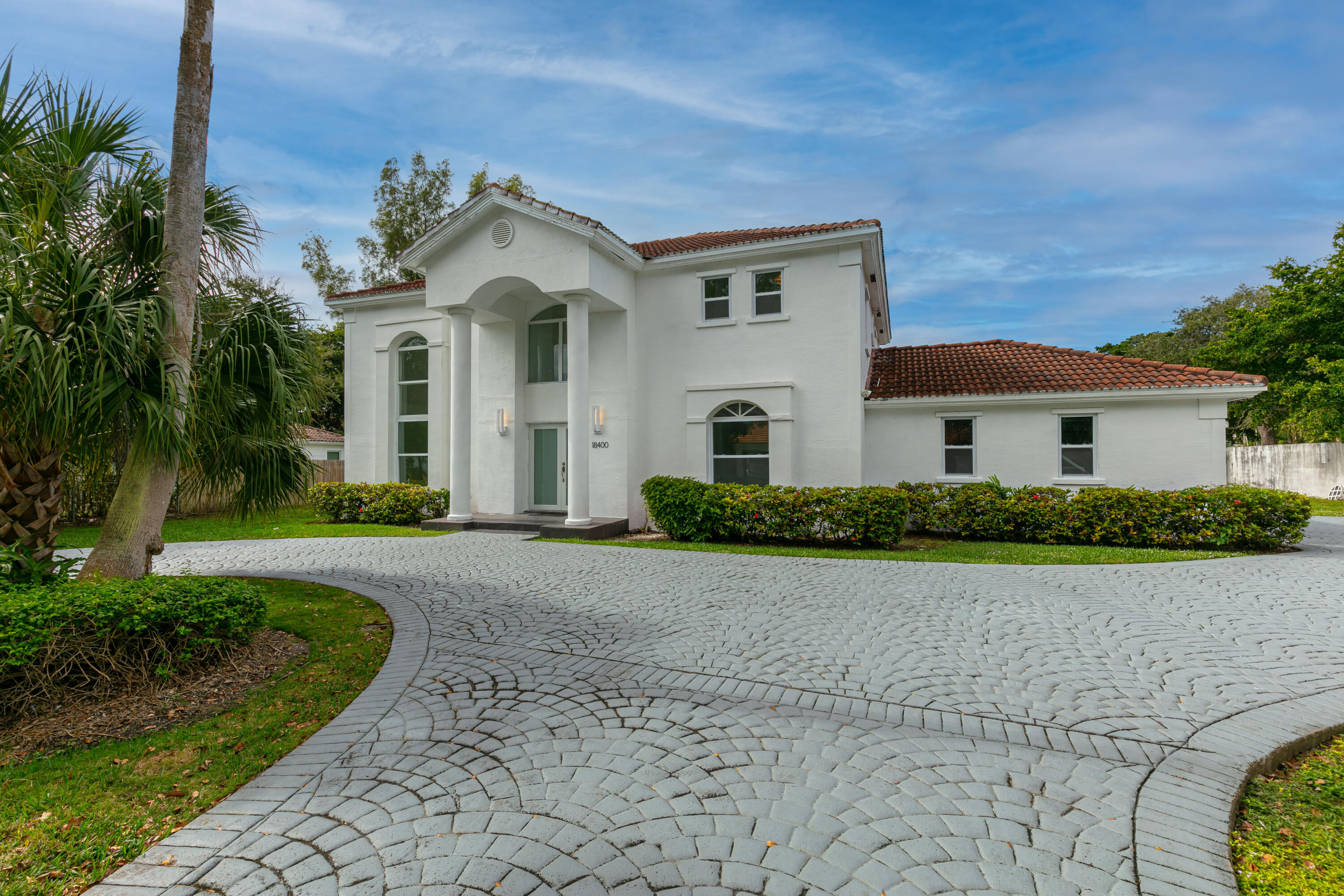 Renovated, Luxurious & Spacious elegant 4BR/3BA Custom architectural design mansion on culdesac. All exterior windows & doors are hurricane impact resistant, energy-efficient. White porcelain flooring throughout. 22' high ceilings. New modern kitchen & bathrooms. New white quartz counters & backsplashes. All new SS superior appliances. Quartz kitchen peninsula island. Glassed breakfast room overlooking spacious yard. New glass shower enclosures. All new modern faucets & fixtures throughout. New washer & dryer. 2 new HVAC systems 2 new hot water systems. 2-car garage w/new Coplay doors. Covered porcelain tiled patios. , across from bay (second house from the Florida Bay). Cool bay breeze. High sloped clay tile roof. Alarm system. Whirlpool jacuzzi in very spacious master bathroom.