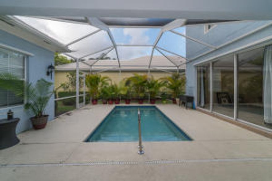 Spectacular luxury 2-story, 3 bedroom + den / 2.5 bath/ 2 car garage, pool, single family home is available in one of the newer Abacoa communities Martinique! Enjoy a large screened-in backyard patio, surrounding a private heated in-ground, lighted pool for relaxing enjoyment day or night! The covered outside lanai is perfect for grilling, outdoor dining and entertaining no matter the weather (and staying dry from the garage into the home)! 
Or find yourself relaxing on the beautifully arched covered front porch or upstairs balcony, which has a view of a natural preserve area. 
Amenities include: wood flooring in office/den, carpet and light ceramic tile throughout, high ceilings, corian counter tops, separate laundry room, central vacuum, this home is available  on 1st July 2016. Attic for storage, thick ceramic tile roof, separate food pantry w/ extra storage, double-paned windows, two phone & cable hook-ups in every bedroom, walk-in his/hers closets in the master bedroom and a separate spa-roman tub in the master bath!!  French doors lead to a separate den which can be transformed into a family room, office, studio or small 4th bedroom with the addition of an armoire. Den/office has fine hardwood flooring. 
You and your guests/family can enjoy swimming year-round in the heated, in-ground lighted pool--even in the evenings as the high, large screen enclosure will guarantee bug-free warm relaxing nights. The pool is positioned for maximum privacy and the screen door from the backyard to the pool has a lock for safety purposes. Protective gates to seal off the pool completely are also provided. Large, high palm trees in the backyard provide the perfect place to relax in a hammock! Or instead enjoy amazing florida sunset-streaked skies from the covered western-exposure balcony upstairs! 
The home is located on a very quiet, less-traveled residential road and is 10 mins from the beach! Hurricane-built / ready. 
The Abacoa community offers a large community pool (one street behind home), jungle-gym kiddie lots and nature/jogging trails within walking distance of the home! A roller-blade park with hockey, racquetball, basketball and tennis courts and the Abacoa downtown shopping center are only minutes away. Abacoa also offers a clubhouse and 18-hole golf course. 
The home is immaculate-- gorgeous, airy and bright from all the windows and a home comfortable beyond belief! 
This is one of the best rentals available in Martinique-- yard maintenance, pest control, landscaping and cable are all included as well! Dogs only welcome! No cats!