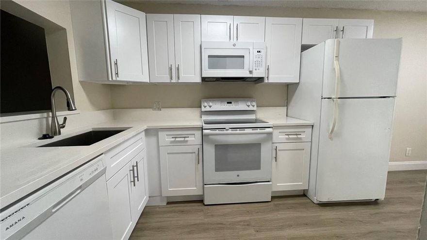 This is a beautiful 3-bedroom, 2-bathroom condo on the first floor. This unit features modern shaker cabinets, quartz countertops, and laminate flooring throughout. It includes a washer and dryer, and water is included in the rent. The property is situated on a large piece of land, perfect for kids to play on. There is plenty of parking available. Realtors, please review the attached criteria with your client before showing the property. ALL HOUSING ASSISTANCE IS ACCEPTED. 3 MONTHS RENT TO MOVE IN. NO PETS