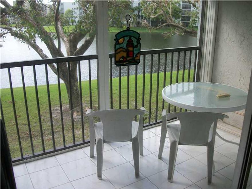 INCREDIABLE WATER VIEW STRAIGHT DOWN TO THE LARGE BEAUTIFUL LAKE, OPEN KITCHEN WITH SNACK BAR, WASHER/DRYER IN UNIT, SCREENED PORCH OVERLOOKING SERENE WATER VIEWS.