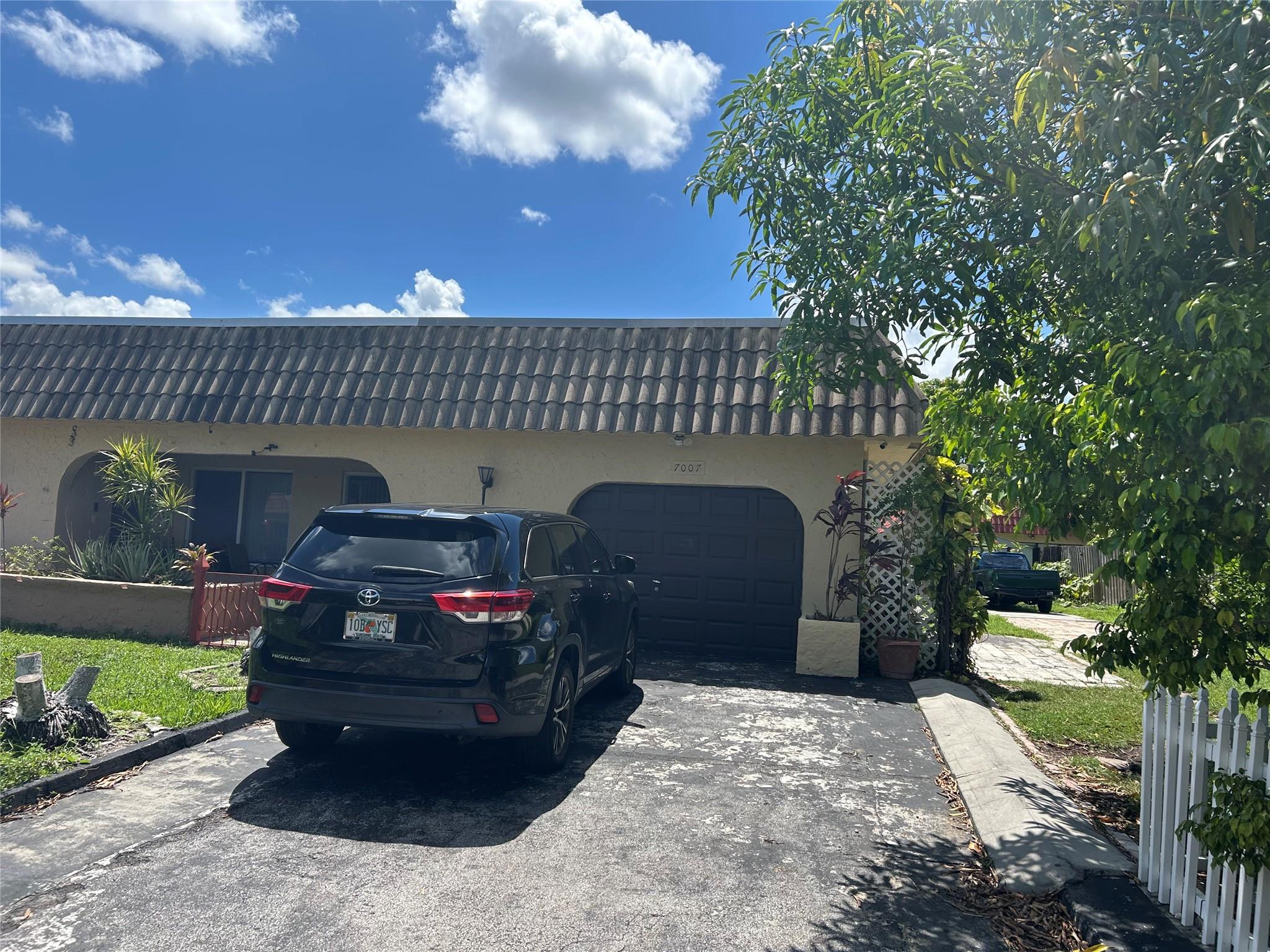 *** Don’t miss this fantastic property! Centrally located in the heart of Tamarac, this spacious unit offers 2 generously sized bedrooms and 2 bathrooms, plus an enclosed patio perfect for a home office. Enjoy the convenience of an in-unit washer and dryer and an attached one-car garage with additional parking for at least 4 more vehicles. The updated kitchen features beautiful granite countertops, an open floor plan, and tile floors throughout, Wood flooring in the bedroom. Private backyard garden on a large lot in a quiet neighborhood. This home is bright, and move-in ready, with no association approval required. Conveniently located near shops, restaurants, schools, hospitals, bus routes, and major roads. Schedule your appointment today ***MOVE IN ONLY FIRST MONTH AND SECURITY DEPOSIT.