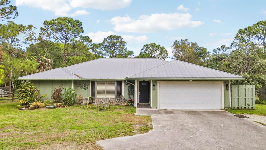 Space, freedom, and room to grow in Jupiter Farms. This 1.25 acre property offers a rare blend of privacy, flexibility, and laid-back Florida living.Ideal for families, hobbyists, or equestrian use. Inside, the home features a bright, comfortable layout filled with natural light and ready for your personal touch. Step outside to wide open space where kids and pets can roam freely, weekend gatherings come easy, and there's plenty of room to add a pool, garden, or custom outdoor retreat. Equestrian-friendly with a barn currently set up for one horse, plus no HOA. Bring your boats, RVs, trailers, and more. Tucked away on a paved road, just a short drive to top-rated schools, shopping, dining, and Jupiter's beautiful beaches, this property offers the best of space, lifestyle, and convenience.
