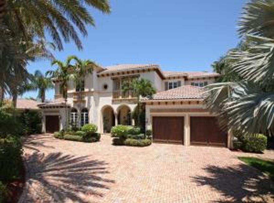 Spectacular deep water view just off Intracoastal! Finest construction w/extensive detail, very private 5 BR w/5775 SF living. 90' frontage, dock for 70' yacht. Marble & wood floors, stone fireplace/columns, marble inlays, soaring 24' coffered ceiling, 3 new a/c units, loft, ensuite baths. Chef's kitchen w/large island, SubZero, Dacor, butler pantry w/wine cooler. Upstairs master suite has private entry w/office/morning bar, his/her walk-in closets. Spacious marble master bath has dome ceiling, oversized shower, Jacuzzi bath, his/her water closets, bidet. Heated pool w/spa, summer kitchen. Premier .33AC, cul-de-sac, no fixed bridges, ocean access. 2 garages. Impact glass (except FR sliders). Gated community. Close to world class shopping, cultural venues, restaurants, parks, & beaches!