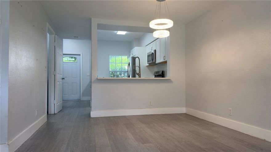 Welcome to this beautifully updated home featuring a modern, open-concept kitchen with shaker cabinets, stainless steel appliances, quartz countertops, and a sleek tile backsplash. The layout offers both functionality and style with luxury vinyl plank flooring throughout, recessed lighting, and updated fixtures. The spacious kitchen flows seamlessly into the main living area, perfect for entertaining or relaxing. This home has been thoughtfully renovated with attention to detail and move-in-ready appeal.