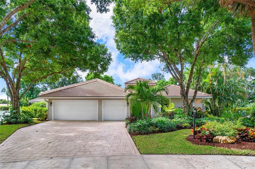If you’ve dreamt of true indoor-outdoor living with a poolside oasis and enviable privacy, this gorgeous courtyard home in Delray’s classic oak-lined Andover community will enchant you. Tucked into a cul-de-sac on a very private lot, the 3666 SF of living space comprise an open, airy main house and a 1/1 guest house (or home office!) Both boast soaring ceilings that open to the courtyard’s saltwater pool and waterfall spa. The main house offers a whole-house generator, 3-car garage with Tesla charging, and a split-bedroom plan with the master and lavishly-remodeled ensuite bath and office on one side, with an additional 2 bedrooms on the other. New roof, AC, and turf, plus full impact windows coming in June, ensure maintenance-free living for decades to come. Enjoy the peace of mind!