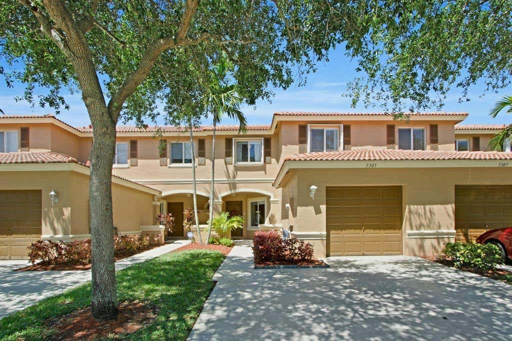 Photo of 5305 Crossing Rocks Court Ct, Riviera Beach, FL 33407 (MLS # R10820064)