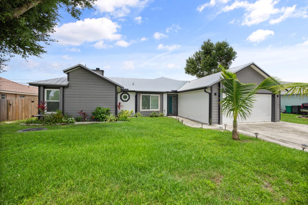 Photo of 3989 SW Jarmer Road, Port Saint Lucie, FL 34953 (MLS # R10999022)