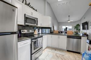 Discover this inviting 2-bedroom, 2-bathroom townhouse in the heart of Lake Worth, offering a perfect blend of comfort and convenience. The open-concept living room is bright and spacious, ideal for relaxing or entertaining guests. The large kitchen boasts ample counter space and cabinetry, making meal prep a breeze. Brand new roof in 2024 and impact windows throughout! Brand new Washer & Dryer in June 2025! New A/C Unit installed July 2025, and impact windows throughout home! Perfectly situated just minutes from stunning beaches, shopping, dining, and top-rated amenities, this home also offers easy access to I-95, making commuting a breeze.