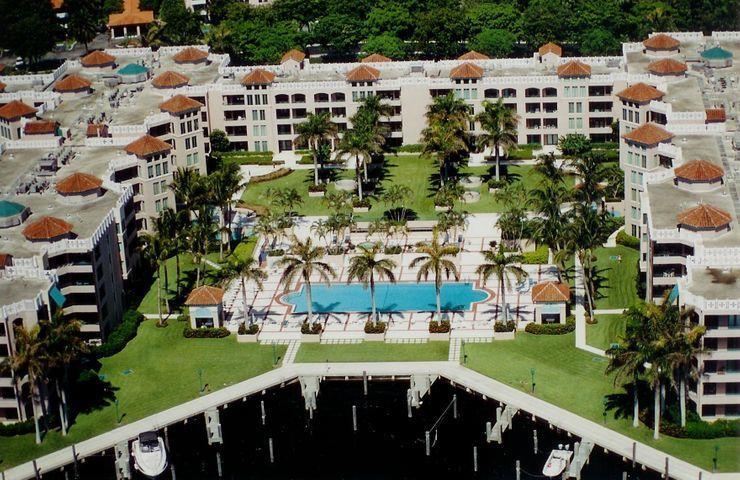 Pristine 2 BR/ 2 BA updated condo with new kitchen, 2nd bathroom, beautiful tile flooring, updated wet bar, master vanity, washer, dryer and more! Very clean, light and bright. Direct access to the garden area and Intracoastal. Convenient to the party rooms, pools, and boat slips just outside your front door! Fantastic amenities at Mizner Court including 2 gyms, 4 outdoor whirlpool spas, covered garage parking, 2 tennis courts, common house boat slip access, billiards room, library, and more! Easy walk to downtown Boca Raton just outside the 24 hour security gate. Convenient to Mizner Park, Boca's gorgeous beaches, Royal Palm shopping plaza, restaurants, and breathtaking promenade along the Intracoastal waterway. Enjoy the finest lifestyle available in the heart of downtown Boca!