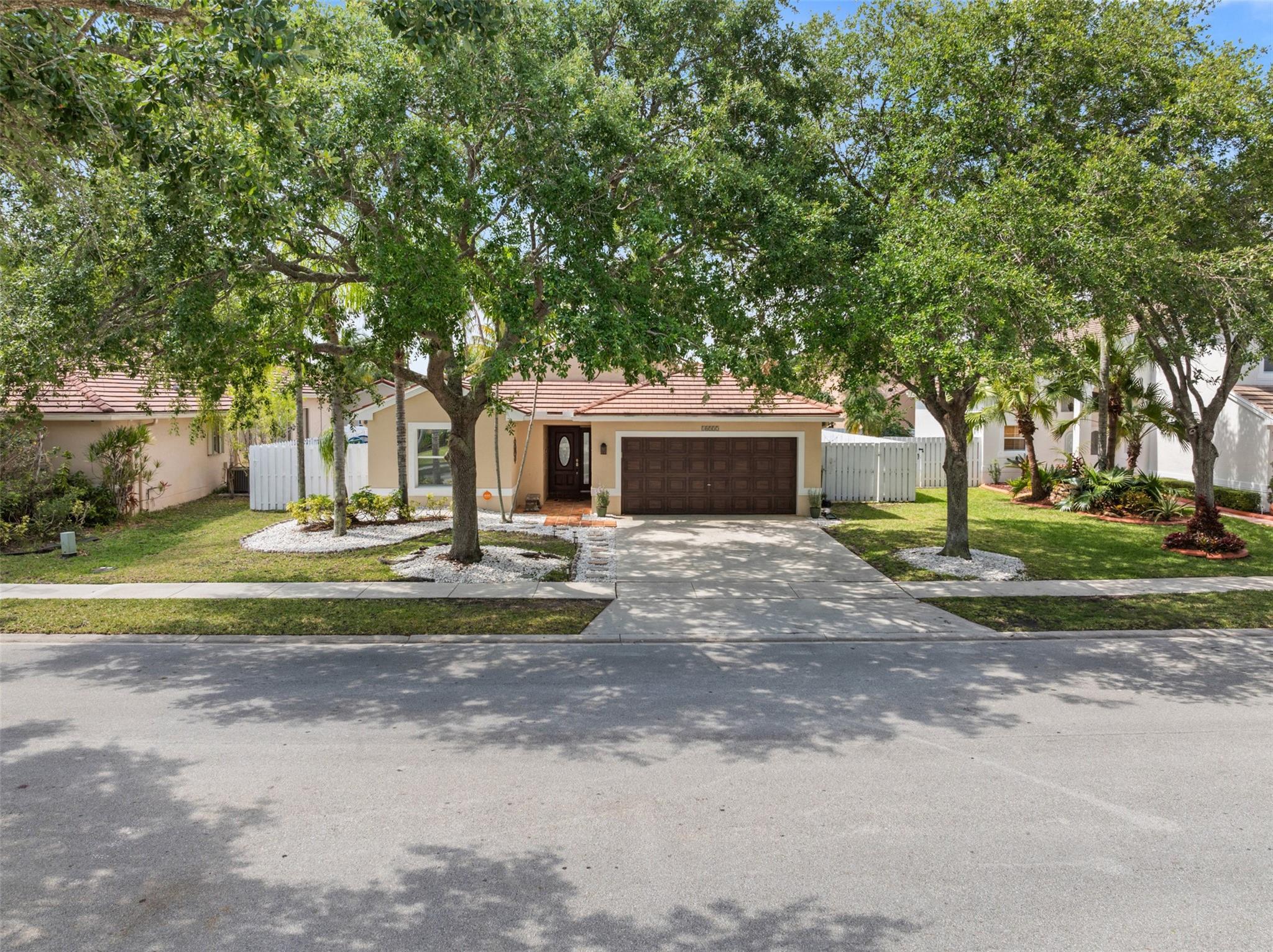 Located in the gated community of Keystone Lake, this 3-bedroom, 2-bathroom home features a private backyard with a pool and an open layout with high ceilings in the main living area. The bright and airy kitchen has been updated with stainless steel appliances and granite countertops. Large windows throughout the home provide plenty of natural light. Zoned in one of the best school districts in Broward County, this property is also in a gated community with a low HOA! **Roof is original and Sellers are offering a credit toward a new roof.** You don't want to miss this one!!