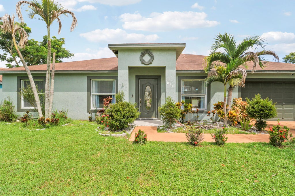 Photo of 825 SE Cavern Avenue, Port Saint Lucie, FL 34983 (MLS # B26075586)