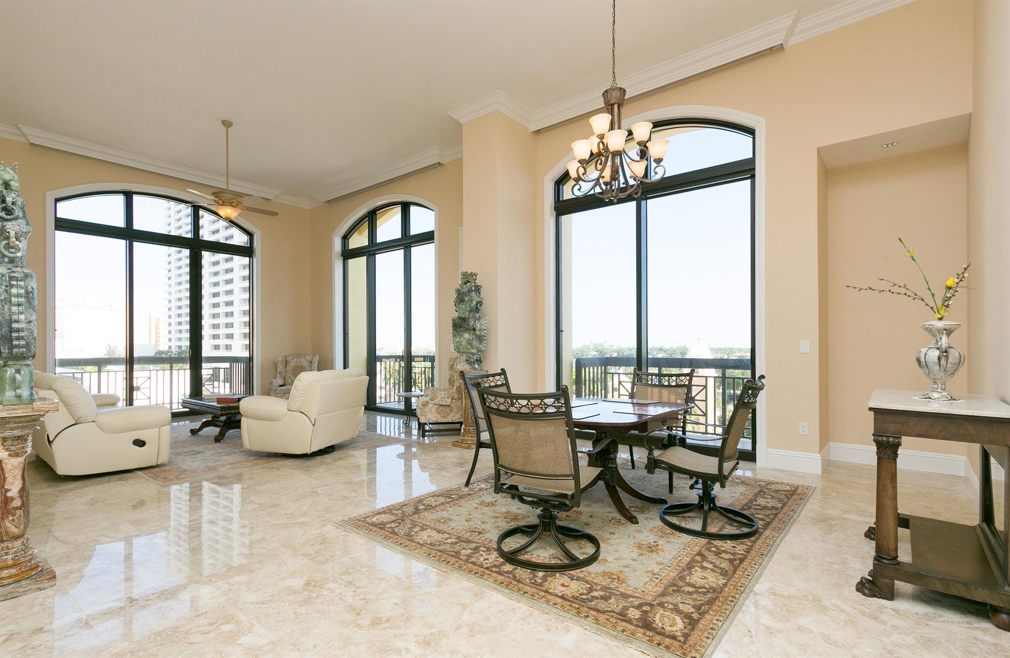 SEASONAL RENTAL WITH SPECTACULAR WATER VIEWS - This fully furnished rare corner NE 2 bedroom, 2.5 bathroom unit has 14 foot ceilings and 5 balconies in a luxurious building. Fabulous bright open great room, master bedroom and large kitchen all looking directly east over the intercoastal. An incredible oversized Master bath- 2 parking spaces right next to unit. Full service building: roof top pool, 24 hour security, fitness center, club room and more. Enjoy restaurants, shopping and entertainment all within walking distance.