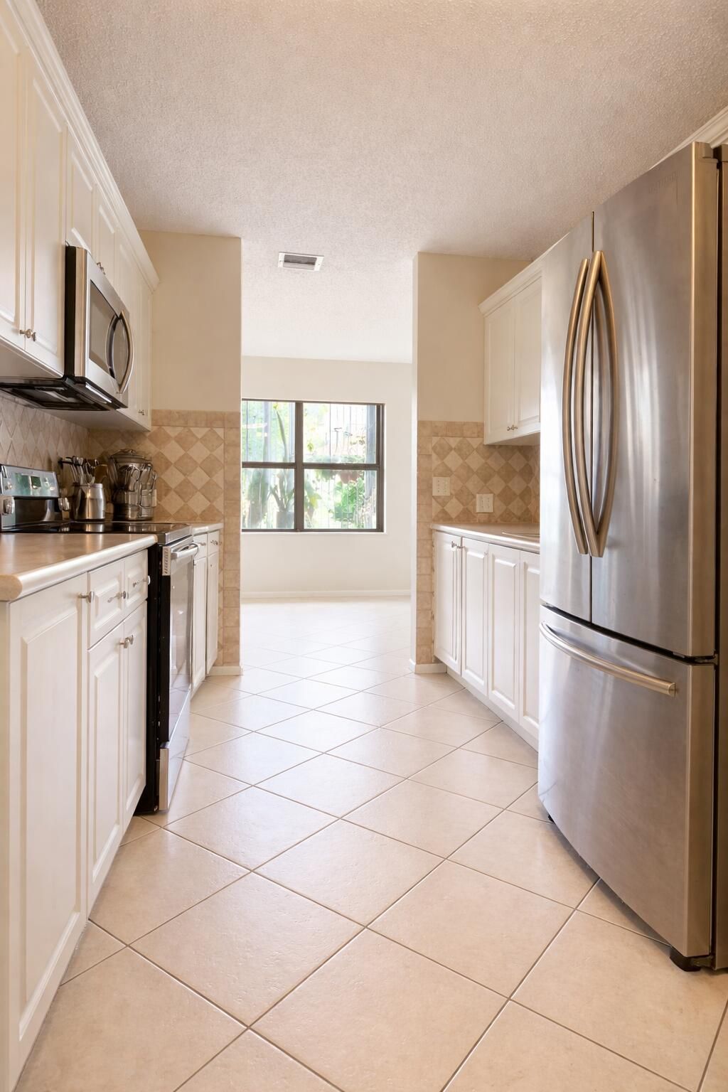 Photo of 5291 Europa Drive #D, Boynton Beach, FL 33437 (MLS # B26004822)