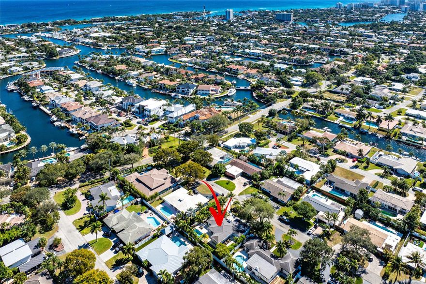 Fully renovated gem in the heart of Lighthouse Point. This 4-bed/2-bath home offers an open, airy layout with 48x48 porcelain floors, smooth coat ceilings, LED high hats, and a striking micro-crete feature wall with built-in shelving, that surrounds the wood-burning fireplace. The chef’s kitchen boasts ItalKraft custom cabinetry, quartz countertops & backsplash, waterfall-edge island w/ storage, Sub Zero/Wolf appliances and a walk-in butler’s pantry & laundry room. Both bathrooms are beautifully updated. Hurricane impact windows and doors, tankless water heater, 2023 AC, 2018 roof, and a private backyard with resurfaced saltwater pool, putting green, and PVC fencing.