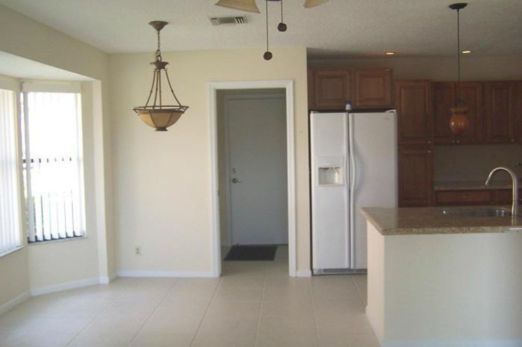 Photo of 8740 Egret Isle Terrace, Lake Worth, FL 33467 (MLS # R11122039)