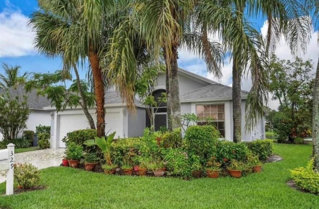 Photo of 329 Hammocks Trail, Greenacres, FL 33413 (MLS # R10884918)