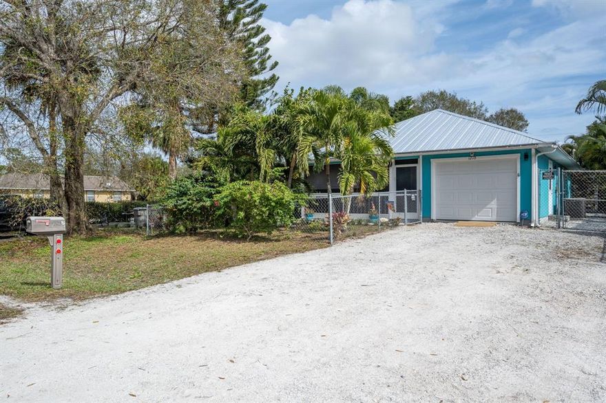 Your tropical retreat awaits! Cute & well maintained 3/2 home with fenced in yard, screened lanai & front porch, tropical foliage & above ground swimming pool. 2021 metal roof w/gutters, shed & ready for the generator hook up. Updated showers, walk in closet in master bedroom. 1/2 garage converted to an office space with ac. No maintenance landscape w/stone walkways and artificial turf.