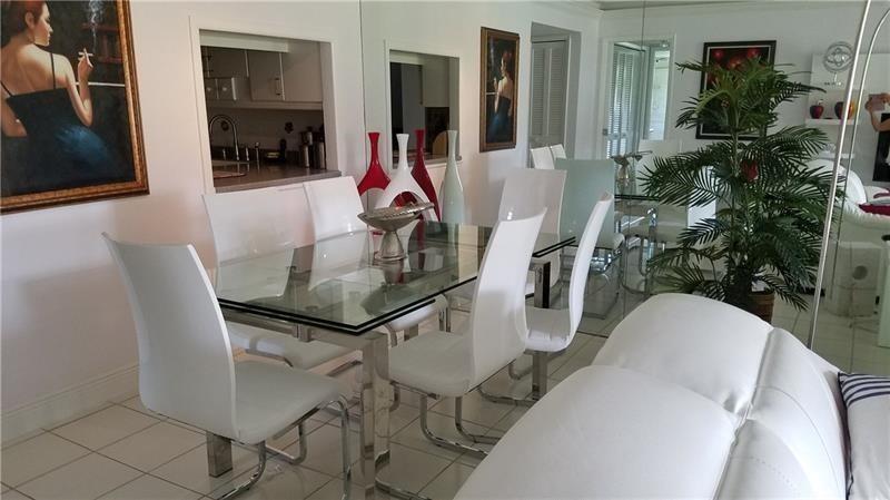 Amazing golf views from this corner, spacious, and bright 1st-floor, 3-bedroom, 2-bath furnished unit at the desirable Palm Aire Country Club (Oaks Course), featuring tile and wood floors throughout, modern furniture, in-unit washer and dryer, and move-in ready—credit score of 650 required.