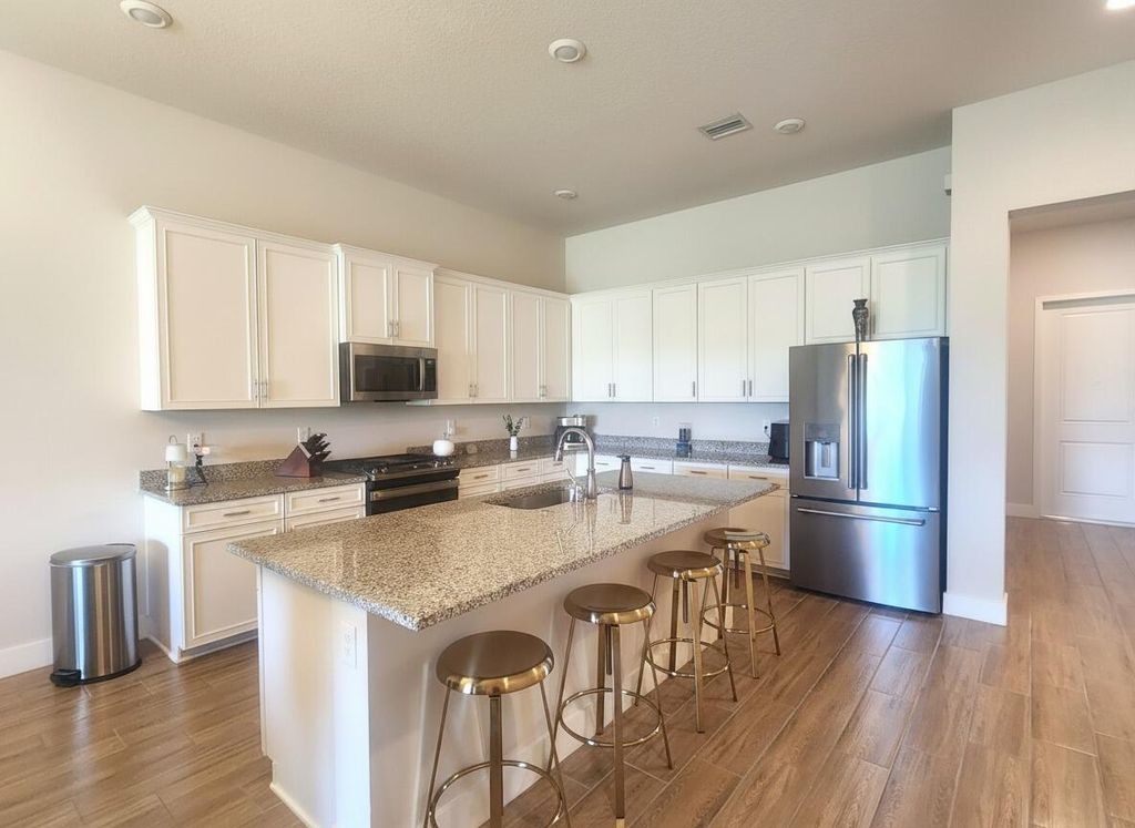 Photo of 7621 S Blue Spring Drive, Parkland, FL 33067 (MLS # B26018614)