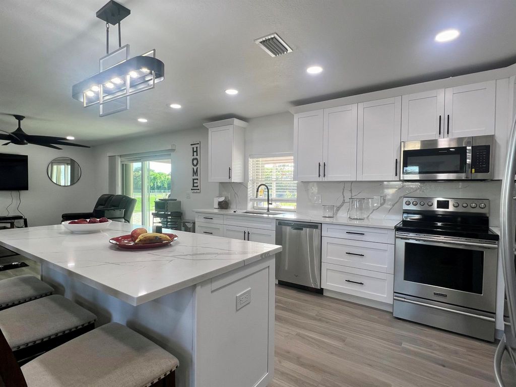 Photo of 224 Akron Road, Lake Worth, FL 33467 (MLS # R11121438)