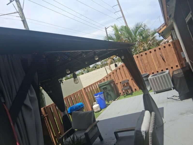 Photo of 1200 PARKSIDE GREEN Drive #E, Greenacres, FL 33415 (MLS # B26075799)