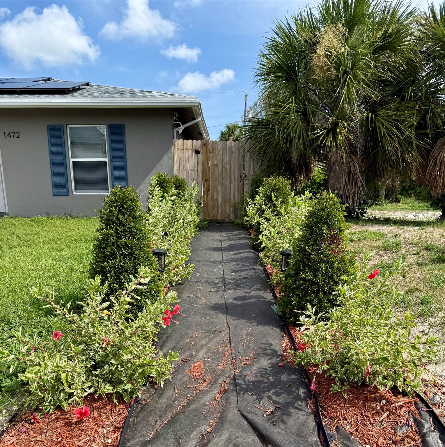 Newer efficiency with a full kitchen and private backyard patio with built in bar with minifridge, TV, swinging loveseat, and table with six chairs. Inside Washer and Dryer just added to the property. Freshly painted. Rent includes all utilities