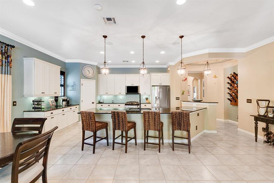 This stunning and highly desirable home in Castellina is move in ready! Beyond the front door is a gorgeous foyer that leads to a beautiful open concept floorplan. The kitchen offers upgraded stainless steel appliances, oversized granite counters.  Enjoy the covered screened lanai or enjoy the outdoor living space featuring new travertine deck and pool, summer kitchen and fire feature. Loaded with upgrades including impact front door, Plantation Shutters, California Closets in all bedrooms and office, Solid Bamboo hardwood floors in the bedroom and office, motorized blackout shades, new laundry room and so much more. Home features Natural Gas! Closes to shopping, dining and  all Equestrian Venues. A rated schools.