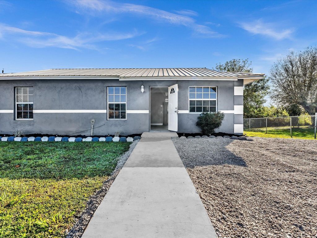 Photo of 285 SW 9th Avenue, South Bay, FL 33493 (MLS # R11065014)