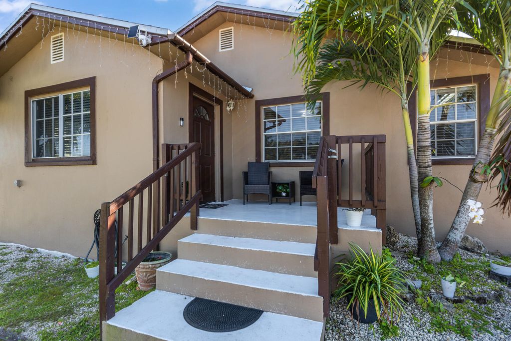 Photo of 16 NW Avenue G, Belle Glade, FL 33430 (MLS # R11159280)