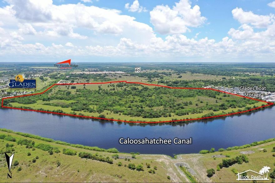 Partial Owner Financing Available with Exceptionally Low Interest Rates!!
Introducing one of the largest and most prestigious remaining waterfront estates along the storied Caloosahatchee River. This remarkable 121.9-acre legacy property, showcasing approximately 3,000 feet of unobstructed water frontage, represents an extraordinary investment opportunity of unmatched scale and potential. With direct, deepwater access to both the Atlantic Ocean and the Gulf of Mexico, the site offers a breathtaking foundation for a luxury residential enclave, world-class RV resort, premier marina, or iconic mixed-use development. 

Commandingly positioned between Glades Boat Storage & Boatyard to the west and Glades RV Resort, Golf & Marina to the east, the property is currently zoned AG/Res yet offers seamless flexibility for residential, commercial, or recreational rezoning. The land has been fully graded and meticulously backfilled with 200,000 cubic yards of owned fill, and the leveled berm has already been reviewed and approved by the USCOErendering the site effectively shovel-ready for immediate development.
Situated within Florida's Opportunity Zone 12O43OOO2OO, this offering affords substantial tax incentives to forward-thinking investors. Ideally located just 14 miles east of LaBelle, 44 miles east of Fort Myers, and 22 miles west of Clewiston, the property balances exceptional accessibility with privacy, exclusivity, and expansive natural beauty. Multiple established access points further enhance the site's versatility, accommodating visions ranging from a destination RV resort to a luxury waterfront community, personal estate, marina, or signature mixed-use project.
Partial owner financing is available, with comprehensive supporting documentation provided upon request. This is a truly rare chance to secure a premier waterfront development opportunity along one of Florida's most desirable and navigable waterways.