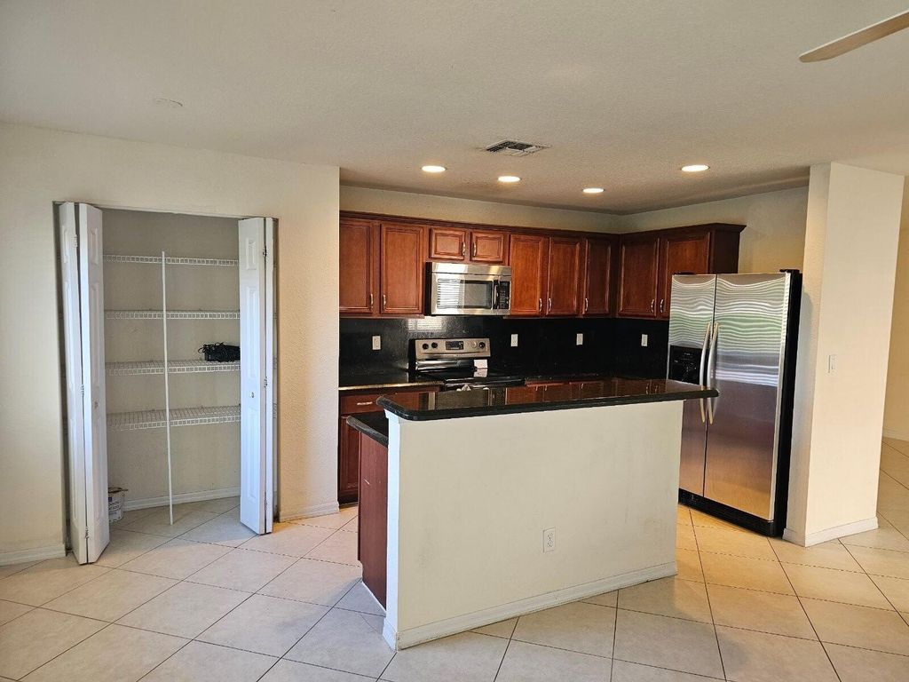 Photo of 2205 SW Rockport Road, Port Saint Lucie, FL 34953 (MLS # R11025155)