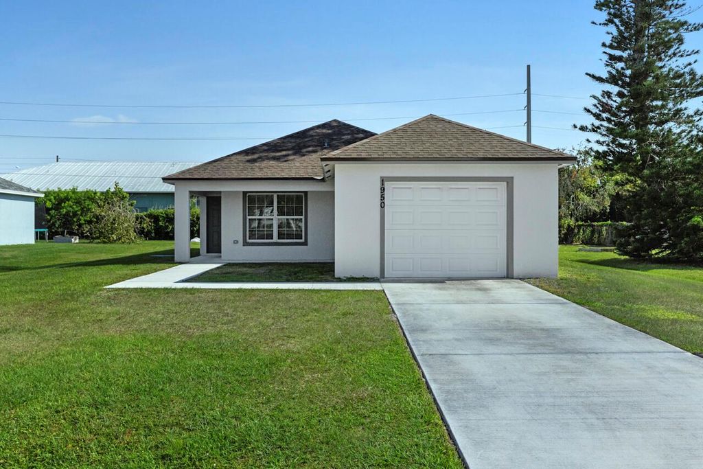 Photo of 1950 SE Gena Road, Port Saint Lucie, FL 34952 (MLS # R11083339)