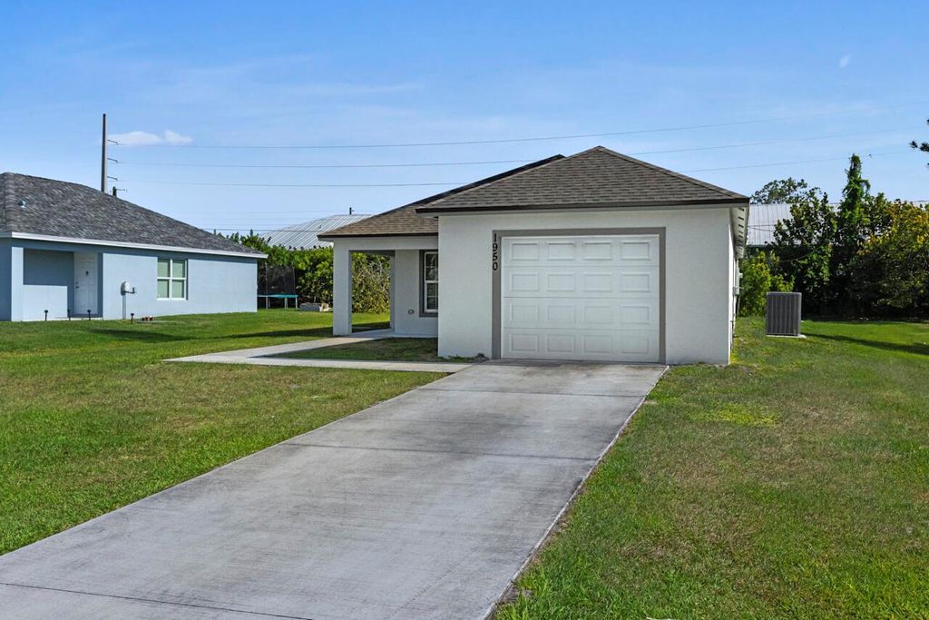 Photo of 1950 SE Gena Road, Port Saint Lucie, FL 34952 (MLS # R11083339)