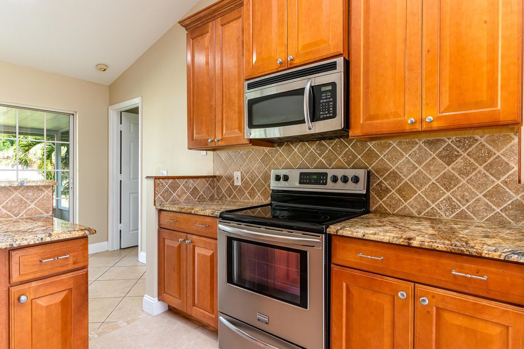 Photo of 431 SE Faith Terrace, Port St Lucie, FL 34953 (MLS # R10906313)