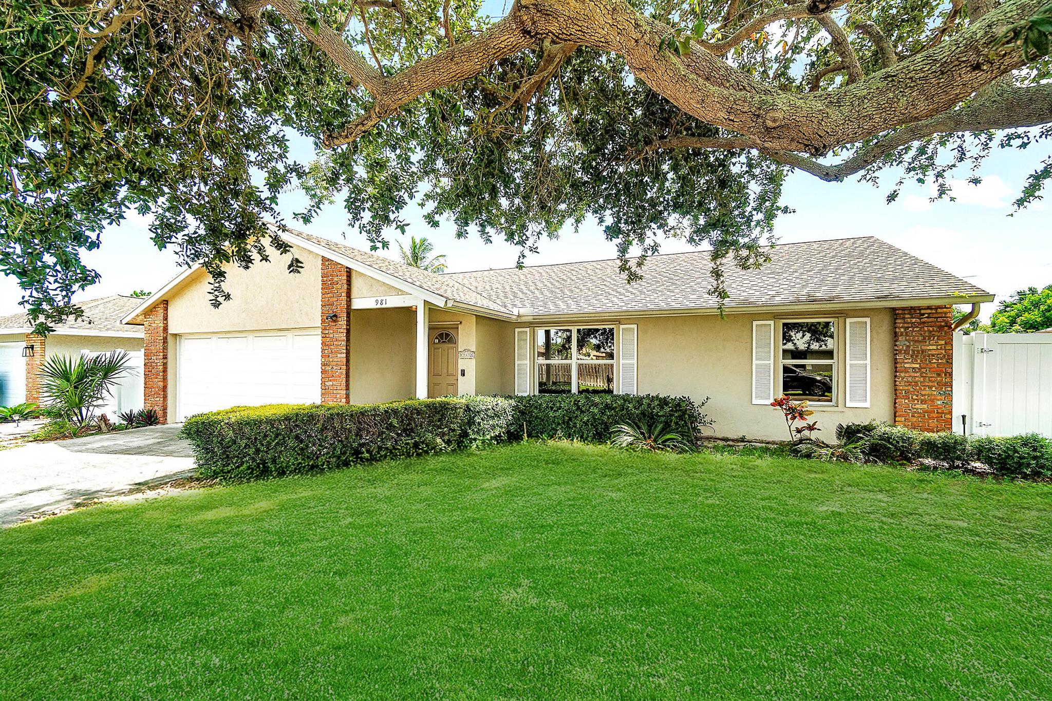 BEAUTIFULLY RENOVATED CBS HOME IN NON-HOA SIDEWALK LINED NEIGHBORHOOD! 2024 HVAC, 2024 Water Heater & More! You don't want to miss this one! Renovated from nearly top to bottom-this home has a newly renovated kitchen with waterfall quarts countertops on an oversized island perfectly fit for entertaining. The living room boasts vaulted ceilings and abundant natural light. A large primary suite offers a beautifully renovated en suite bathroom, walk-in closet as well as additional wardrobe storage. Across the home you will find two well appointed bedrooms and another newly renovated bathroom. Off the back of the home you will find a screened in lanai and a backyard with room for a pool.