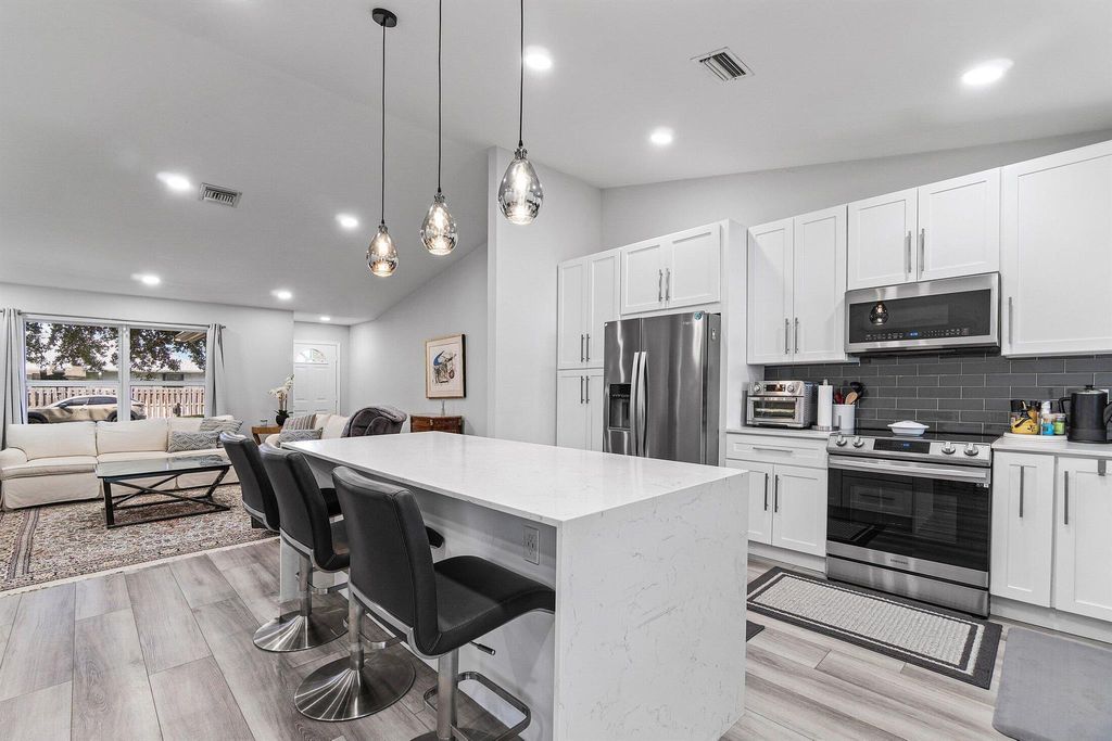 Photo of 981 Wynndale Way, Lantana, FL 33462 (MLS # R11106787)