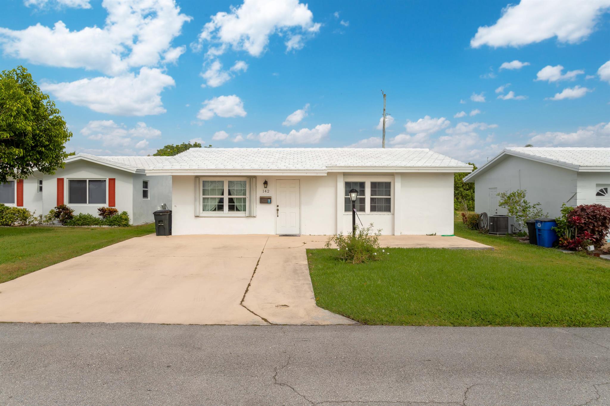 Welcome to this beautifully renovated home with a screened-in patio and no rear neighbors. This home was converted from a 2 bedroom to a large 1 bedroom, offering handicapped accessibility throughout. The bedroom has ample space with a large walk-in closet. The kitchen has been updated with stainless steel appliances, granite countertops, and white cabinetry. The bathroom has also been updated very tastefully. With porcelain tile throughout, and accordion shutters this home provides comfort and beauty! Washer/dryer are inside for your convenience. Leisureville has a low monthly HOA with amazing amenities including multiple pools, a fitness center, game room, a par 3 golf course, and more for your enjoyment. Perfect for annual or seasonal living.