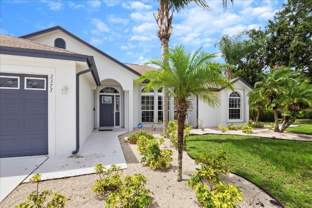 Photo of 2377 SW Fern Cir, Port Saint Lucie, FL 34953 (MLS # F10291896)