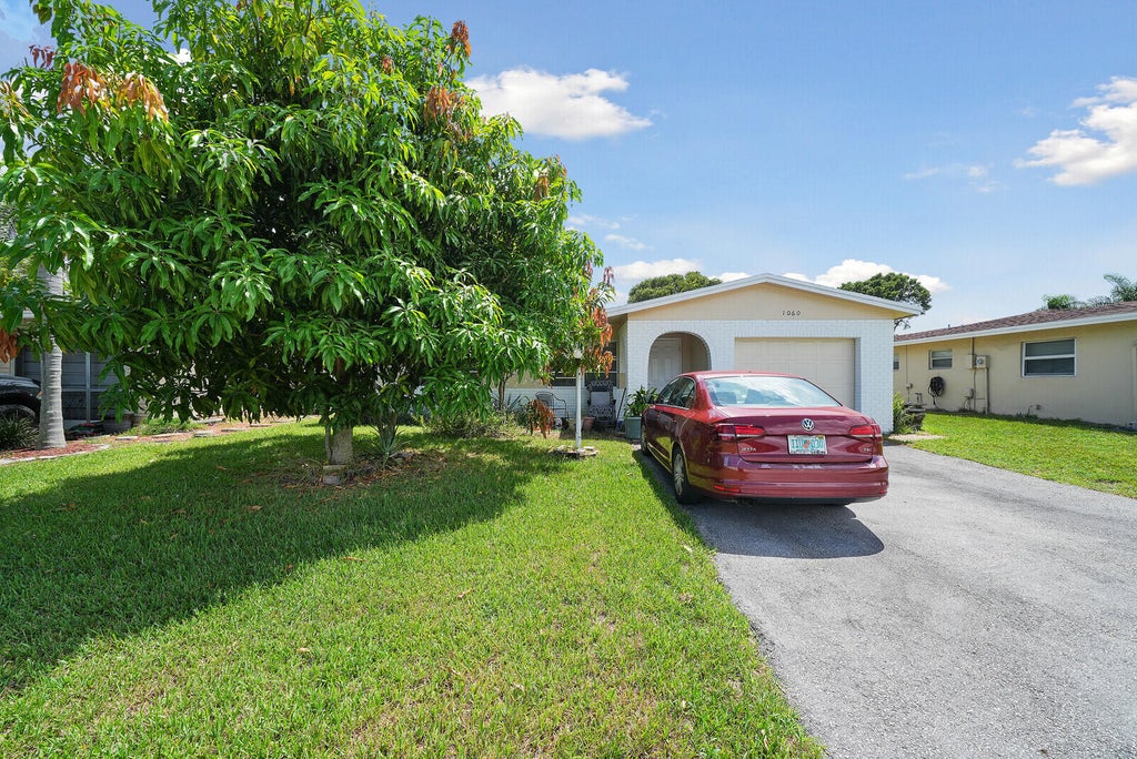 Photo of 1060 NW 49th Court, Deerfield Beach, FL 33064 (MLS # B26071822)