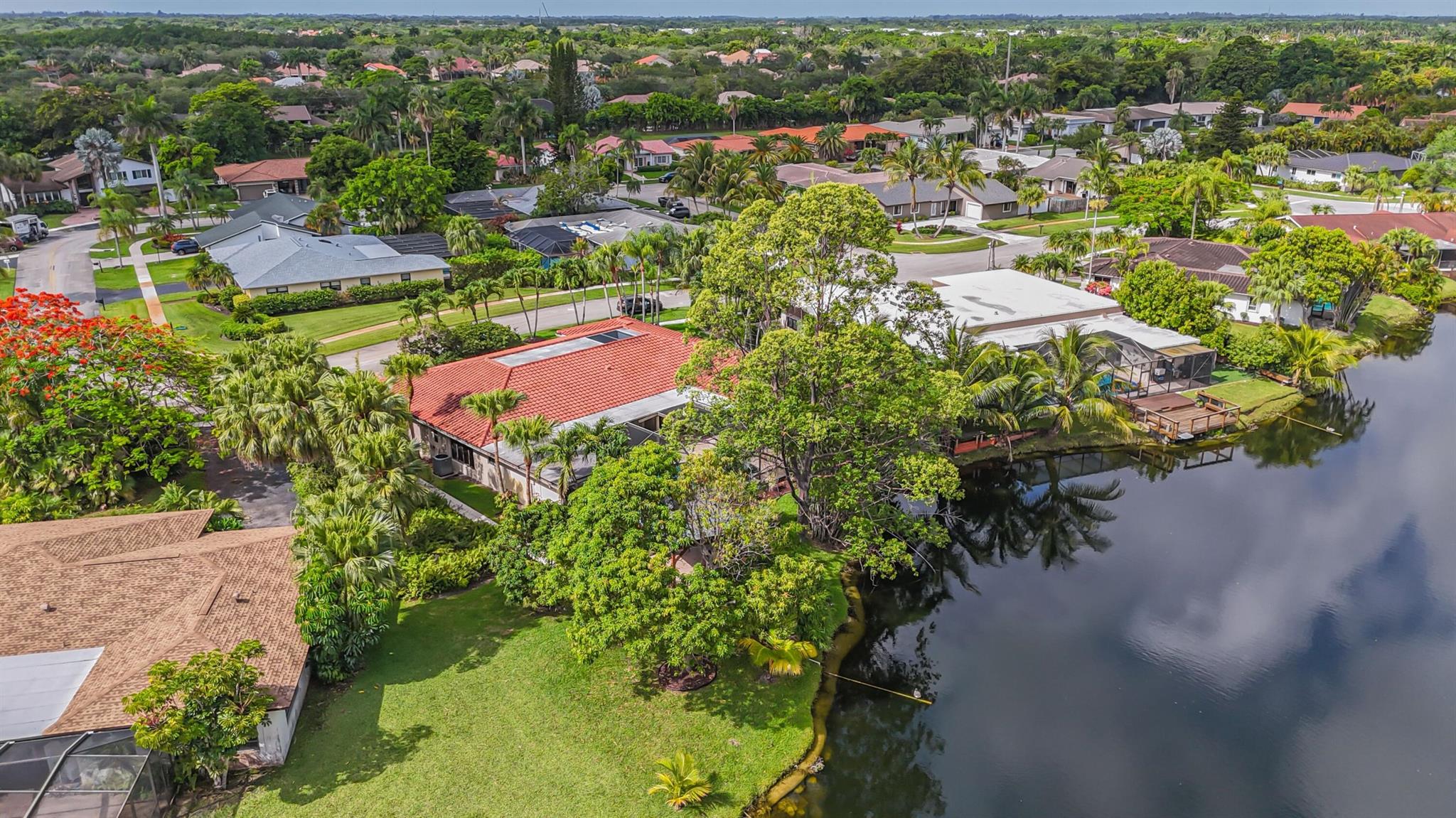 Your vision is here to live! Your search is over at this fabulous house with views of a beautiful lake!Welcome to 16541 Royal Poinciana Drive featuring a new 2021 s tile roof set on a spacious 3,600 sf of living space.This upgraded a few years ago house offers 3bedrooms-3full bathrooms-den/office-family room with an spacious open floor plan of living and dinning room.Enjoy a beautiful atrium as you come into the house that brings natural light and tranquility thru their glass and open space. Your chef's kitchen is equipped with s/s appls-large wood kitchen cabinets and a spacious farmhouse sink. Family room and bar are adjacent to the kitchen offering a great space for entertainment as well as is your patio- pool-pergola-summer kitchen area. Bonaventure town center club proximity