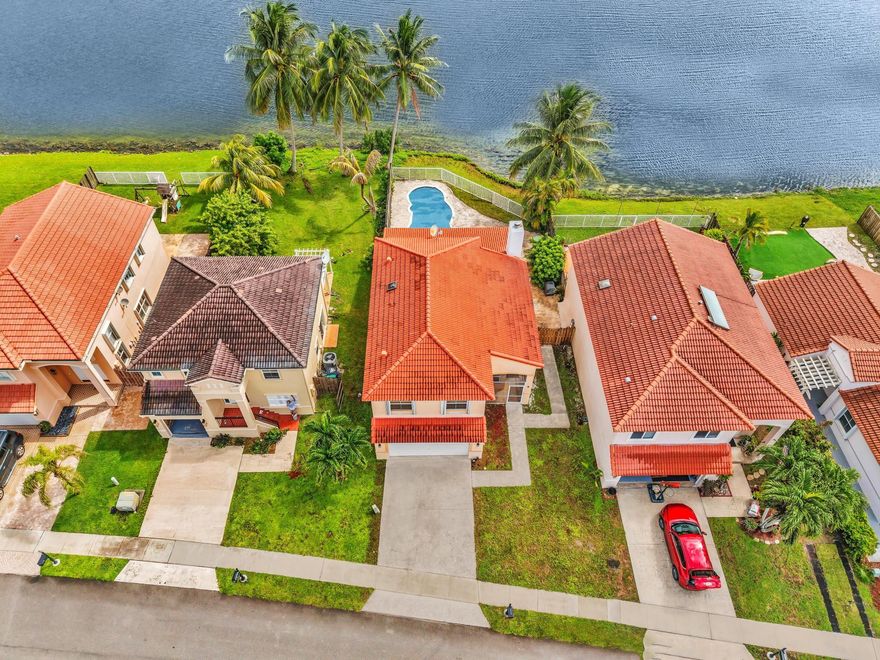 LOW $17 a month HOA. Welcome to the gated community of Coral Bay. This lake view property features 3br, 2.5 bath and a 2 car garage. Enjoy your private backyard with your own private pool.  Roof was replaced in 2022. Inside you'll find a bright and spacious layout designed for comfort and functionality. Large windows fill the home with natural light. The kitchen has granite countertops and stainless steel appliances. The community has 3 pools, gym, playground and more. Close to shopping and major highways.