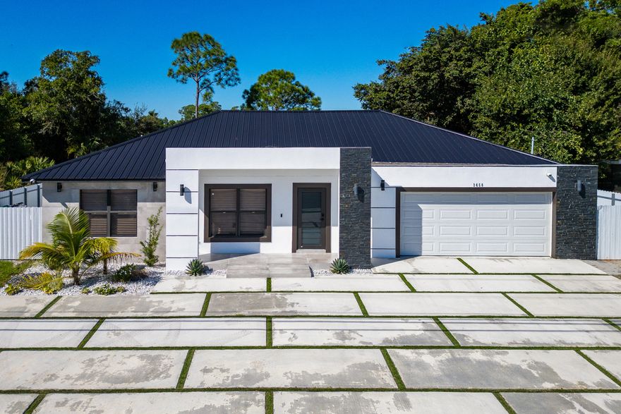 Stunning 3-bedroom, 2-bath home with office offering exceptional resort-style outdoor living in Port St. Lucie. This property features an open-concept layout with abundant natural light and well-appointed living spaces.
The backyard is an entertainer's dream, showcasing a large swimming pool, pool house with outdoor kitchen, freestanding pergola, and a convenient half outdoor bathroom located on the patio. Additional highlights include a private half-court basketball area, ideal for recreation and entertainment. The garage has been converted into a private apartment-style space, complete with an independent bathroom, kitchen, and split A/C system, offering flexibility for guests, extended family, or potential income opportunities.